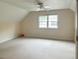 Spacious bedroom with carpet, a ceiling fan, and natural light from a large window at 308 Sunset Creek Cir, Chapel Hill, NC 27516