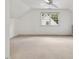 Spacious bedroom features a ceiling fan and a large window overlooking the neighborhood at 308 Sunset Creek Cir, Chapel Hill, NC 27516