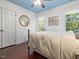 Bedroom featuring a ceiling fan, hardwood floors and natural light from multiple windows at 308 Sunset Creek Cir, Chapel Hill, NC 27516