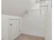 Smaller closet features one wire shelving rack and a carpeted floor at 308 Sunset Creek Cir, Chapel Hill, NC 27516