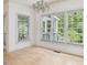 Well-lit dining room with large windows offering views of the outdoor area at 308 Sunset Creek Cir, Chapel Hill, NC 27516