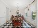 Formal dining room with black and white floors, chandelier, and classic decor at 308 Sunset Creek Cir, Chapel Hill, NC 27516