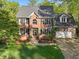 Charming two-story brick home with a well-manicured lawn and a two-car garage at 308 Sunset Creek Cir, Chapel Hill, NC 27516