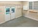 View of the garage with white cabinets and shelving on the walls at 308 Sunset Creek Cir, Chapel Hill, NC 27516