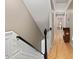 View from the top of the stairs to the hallway with wood floors at 308 Sunset Creek Cir, Chapel Hill, NC 27516