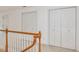Second floor hallway features doors to the closets with wooden banister at 308 Sunset Creek Cir, Chapel Hill, NC 27516