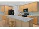 Well-equipped kitchen with stainless steel appliances, granite countertops, and center island at 308 Sunset Creek Cir, Chapel Hill, NC 27516