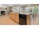 Kitchen island features granite countertops, stainless steel appliances, and ample cabinet space at 308 Sunset Creek Cir, Chapel Hill, NC 27516