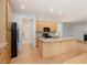Well-lit kitchen featuring granite countertops, an island, and stainless steel appliances at 308 Sunset Creek Cir, Chapel Hill, NC 27516
