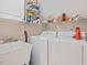 Laundry room with washer, dryer, utility sink, and shelving at 308 Sunset Creek Cir, Chapel Hill, NC 27516