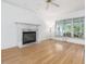 Spacious living room featuring fireplace, hardwood floors, and natural light at 308 Sunset Creek Cir, Chapel Hill, NC 27516
