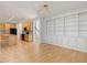 Bright living room features hardwood floors and an abundance of built-in shelving with kitchen view at 308 Sunset Creek Cir, Chapel Hill, NC 27516