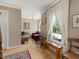 Bright living room featuring a large window, hardwood floors, and cozy seating area at 308 Sunset Creek Cir, Chapel Hill, NC 27516