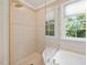 Bathroom with a separate shower, soaking tub and tiled walls at 308 Sunset Creek Cir, Chapel Hill, NC 27516