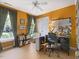 Office with hardwood floors, windows with drapes, and built-in bookcase at 308 Sunset Creek Cir, Chapel Hill, NC 27516