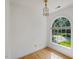 Bright office space with hardwood floors, classic trim, and a large window offering natural light at 308 Sunset Creek Cir, Chapel Hill, NC 27516
