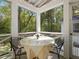 Covered patio featuring white columns, a vaulted ceiling, with views of trees and lawn at 308 Sunset Creek Cir, Chapel Hill, NC 27516