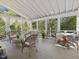 Covered patio featuring white columns, a vaulted ceiling, and comfortable seating arrangements at 308 Sunset Creek Cir, Chapel Hill, NC 27516