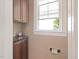 Cozy powder room with neutral paint and small window at 308 Sunset Creek Cir, Chapel Hill, NC 27516
