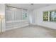 Bright room featuring large windows and built in shelving at 308 Sunset Creek Cir, Chapel Hill, NC 27516