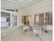Inviting screened porch with white-washed flooring and wicker seating, ideal for enjoying the outdoors at 308 Sunset Creek Cir, Chapel Hill, NC 27516