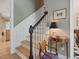Beautiful staircase with natural wood steps and black banister at 308 Sunset Creek Cir, Chapel Hill, NC 27516