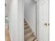 Stairway with carpet leading from one level of the home at 308 Sunset Creek Cir, Chapel Hill, NC 27516