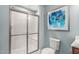 Bathroom showcasing white-tiled shower, modern fixtures, and contemporary decor at 35 Boots Ridge Way, Franklinton, NC 27525