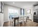 Dining area with a table and six chairs next to the kitchen at 35 Boots Ridge Way, Franklinton, NC 27525