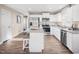 Well-lit kitchen equipped with stainless steel appliances, white cabinets, and granite countertops at 35 Boots Ridge Way, Franklinton, NC 27525