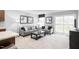 Comfortable living room featuring contemporary furnishings, soft carpet, and access to a sliding glass door at 35 Boots Ridge Way, Franklinton, NC 27525