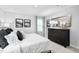 Calm main bedroom featuring neutral décor, a dark dresser, and ample natural light at 35 Boots Ridge Way, Franklinton, NC 27525