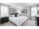 Relaxing main bedroom featuring neutral décor, stylish curtains, and ample natural light at 35 Boots Ridge Way, Franklinton, NC 27525