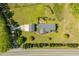 Stunning aerial view of a charming home with lush landscaping and a detached garage at 3604 Stagecoach Rd, Durham, NC 27713