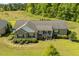 Aerial view of a charming home with landscaped yard, walkway, and a welcoming front porch at 3604 Stagecoach Rd, Durham, NC 27713