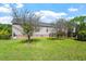 Fenced backyard and view of the home's exterior showcasing a well-maintained lawn and garden at 3604 Stagecoach Rd, Durham, NC 27713
