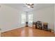Bedroom with wood flooring, a ceiling fan, and natural light from the windows at 3604 Stagecoach Rd, Durham, NC 27713