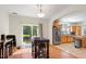 Dining area with table, access to the back yard, and view into the kitchen at 3604 Stagecoach Rd, Durham, NC 27713