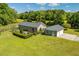 Beautiful exterior with a fenced-in yard, patio, and detached two-car garage at 3604 Stagecoach Rd, Durham, NC 27713