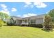 Inviting home featuring a covered porch, manicured landscaping, and a well-maintained lawn at 3604 Stagecoach Rd, Durham, NC 27713