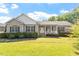 Charming one-story home with covered porch and well-manicured landscaping at 3604 Stagecoach Rd, Durham, NC 27713
