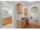 Hallway with access to the bathroom, storage cabinets, and views into other rooms at 3604 Stagecoach Rd, Durham, NC 27713