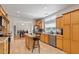 Eat-in kitchen with an island and stainless steel appliances; opens to dining and living areas at 3604 Stagecoach Rd, Durham, NC 27713