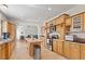 Bright eat-in kitchen features stainless appliances, island, and an open floor plan to the living area at 3604 Stagecoach Rd, Durham, NC 27713
