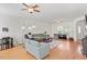 Bright living room with hardwood floors, comfortable seating, and an abundance of natural light at 3604 Stagecoach Rd, Durham, NC 27713