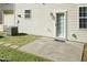 Home's backyard featuring a concrete patio, and exterior doorway and window on a well maintained yard at 3819 Valleydale Dr, Durham, NC 27703