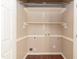 Empty closet or storage space with shelves, rack, and water supply connections at 3819 Valleydale Dr, Durham, NC 27703