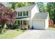 Charming two-story home with a front porch, attached garage, and well-maintained landscaping at 3819 Valleydale Dr, Durham, NC 27703