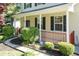 Welcoming front porch with decorative glass door and stylish lighting fixture at 3819 Valleydale Dr, Durham, NC 27703
