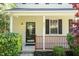 Welcoming front porch with decorative glass door and stylish lighting fixture at 3819 Valleydale Dr, Durham, NC 27703